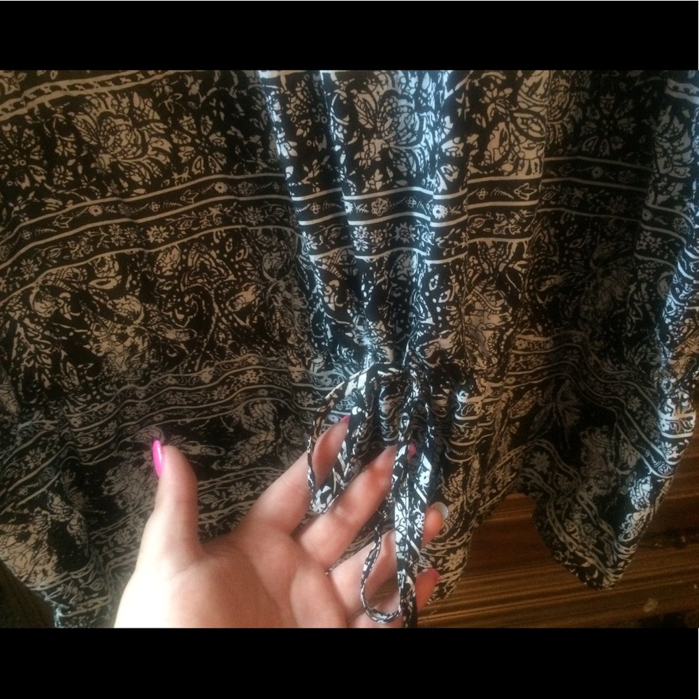 Black and white patterned top with brass buttons